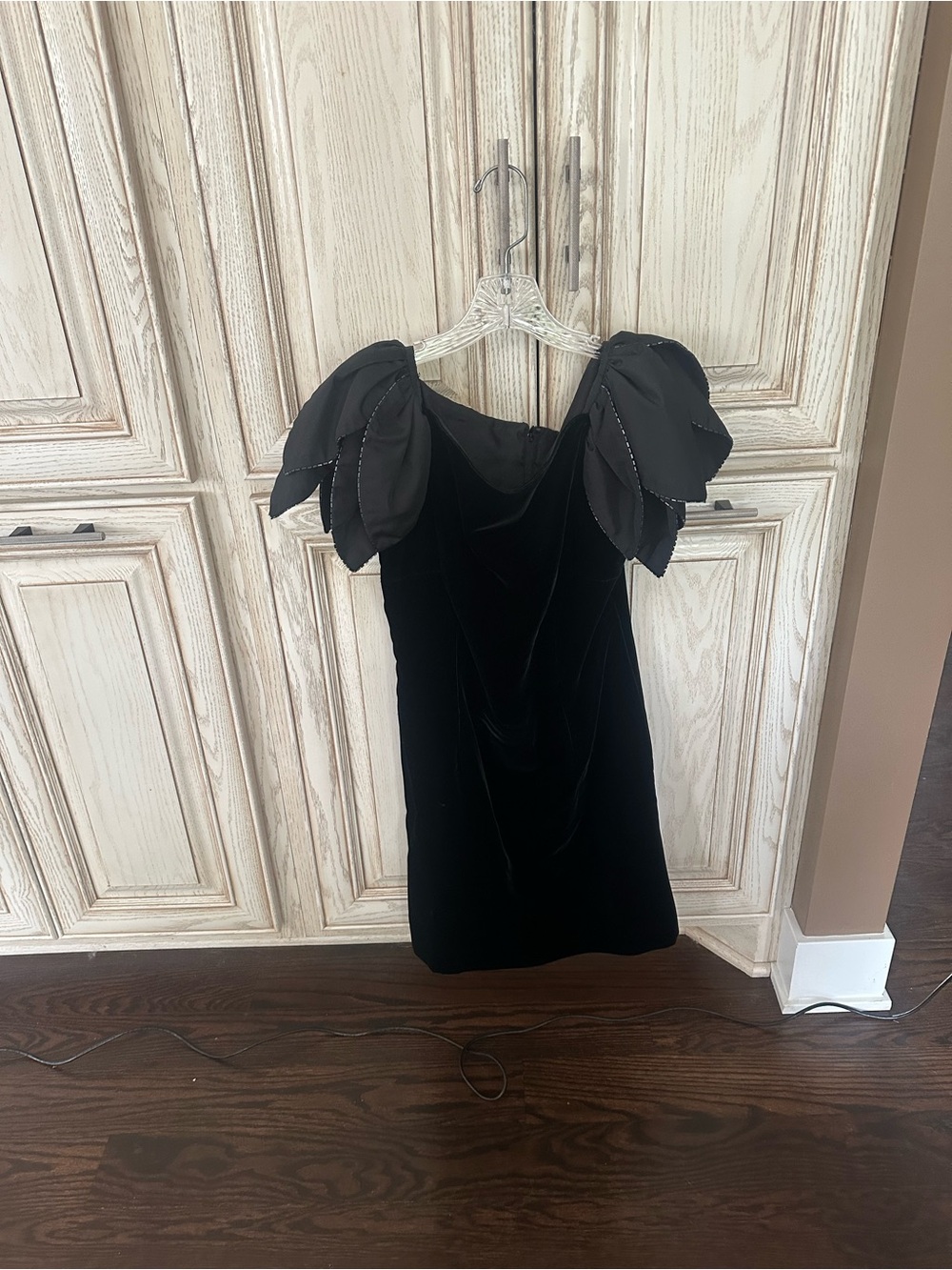 Vintage black velvet dress featuring structured, layered satin "petal" sleeves